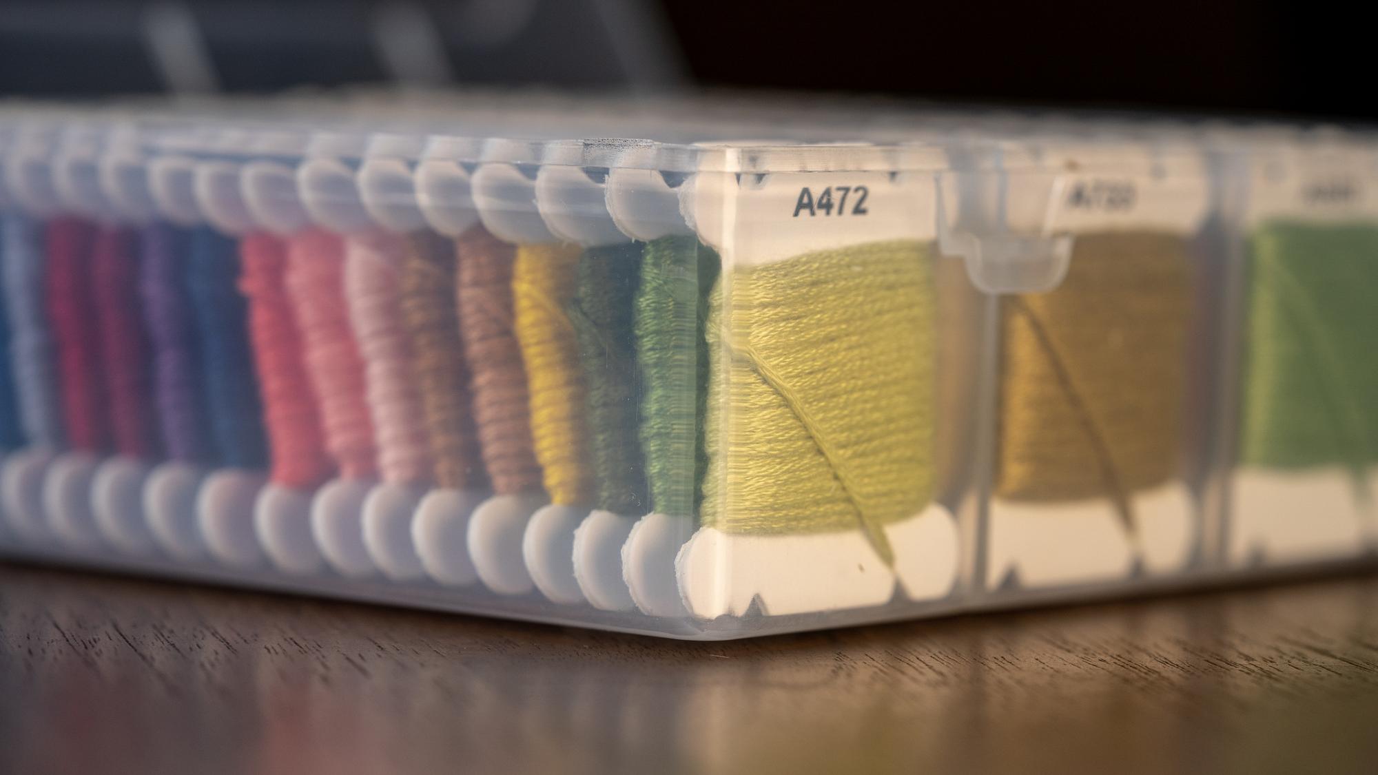 stack of embroidered samples on table